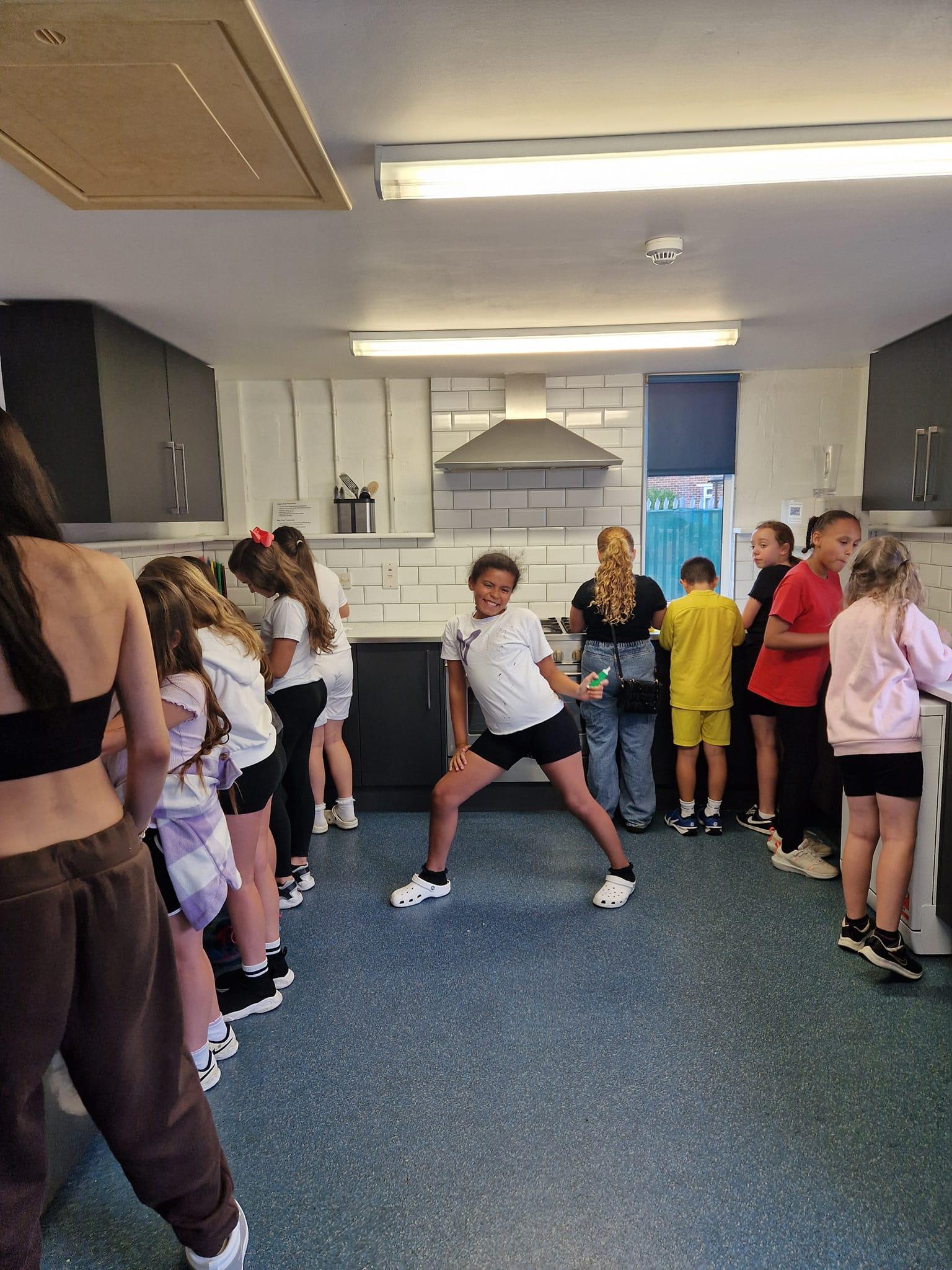 Young people taking part in an indoor activity with the team.