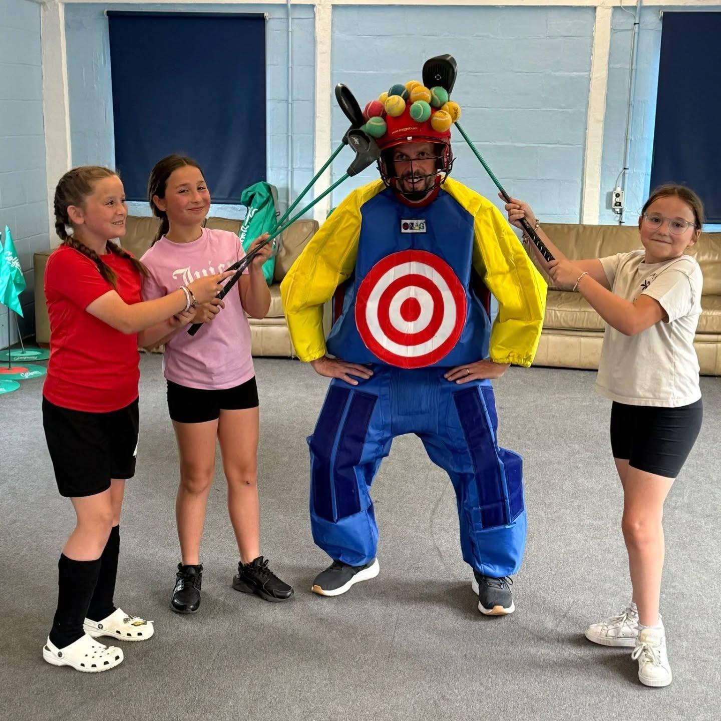 Young people taking part in a fun target game with staff.